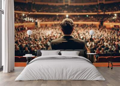 Motivational speaker standing on stage with spotlight Wall mural