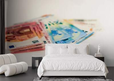 Close up money euro banknotes and coins on white background. Wall mural