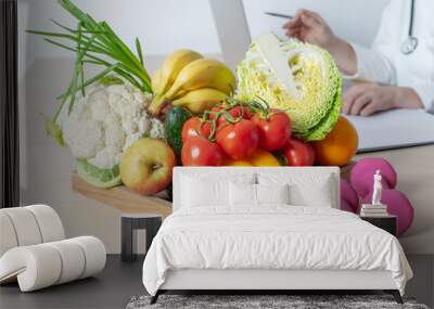 Nutritionist table with healthy fruits and vegetables. Diet consultation. Wall mural