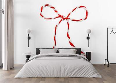 Red and white Christmas rope isolated on white. Christmas tied bow for design. Wall mural