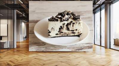 Unbaked creamy cheesecake with chocolate cookies and cream biscuits. Wall mural