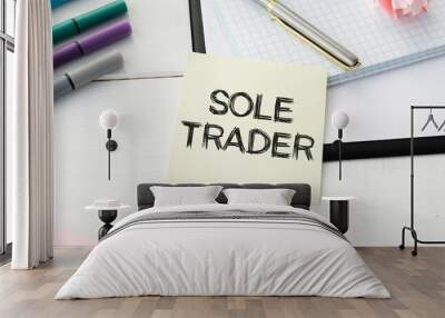 SOLE TRADER, text on white notepad on craft background Wall mural