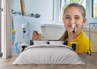 The girl draws a picture by numbers Wall mural