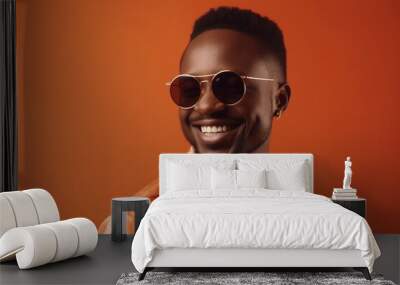 Studio shot of a young handsome african man in sunglasses wearing elegant casual clothes against an orange background. generative ai Wall mural