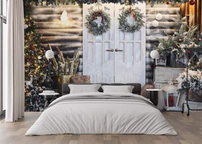 Winter rustic interior decorated for New year with artificial snow and Christmas tree. Winter exterior of a country house with Christmas decorations in rustic style. Christmas eve Wall mural