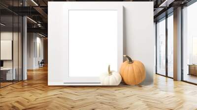 Mockup of blank frame with pumpkin on light background Wall mural