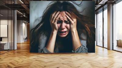 Close-up of a woman's face, caught in an authentic scream, conveying raw emotion. Her expression reveals struggle, anxiety, panic, and depression - a stark portrayal of mental health. Wall mural