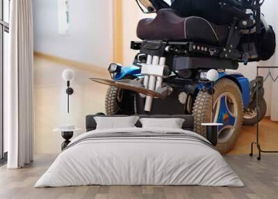 blue electric wheelchair for disabled people - indoors Wall mural