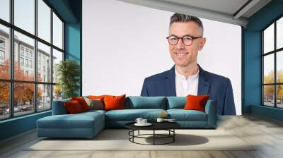 Cropped portrait of a handsome mature businessman in glasses isolated over white background Wall mural