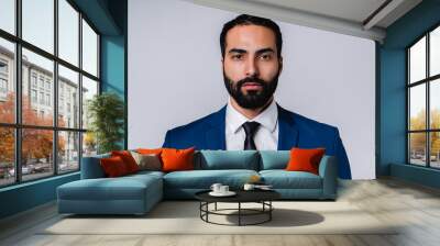 Serious successful Arabian businessman in formal attire isolated over grey background Wall mural