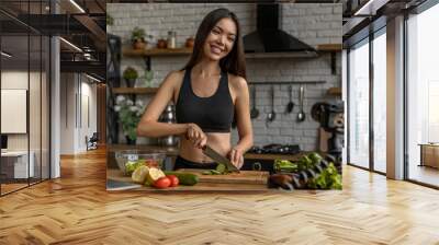 Young happy woman in kitchen recording content for videoblog Wall mural