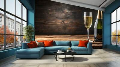 Glass and bottle of champagne on rustic wooden table with dark background Wall mural