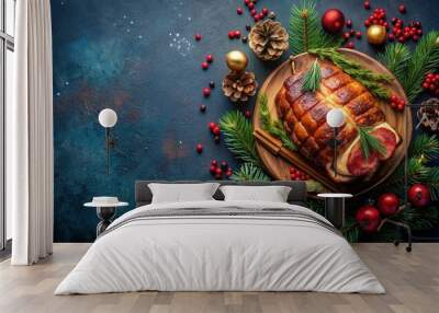 Roast pork neck in Christmas style on dark navy blue background with festive accessories, top view Wall mural