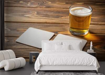 Two blank square beer coasters on a wooden table background Wall mural