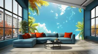 A beautiful tropical scene with palm trees and a bright blue sky. The sun is shining brightly, creating a warm and inviting atmosphere Wall mural