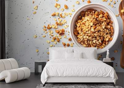 a bowl of granola next to a spoon on a table Wall mural