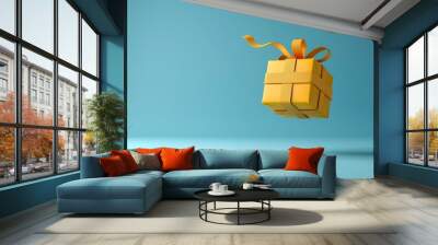 A yellow box with a ribbon on top of a blue background. The box is floating in the air, giving the impression of a gift being opened Wall mural