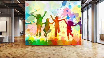 group of children jumping in the air with their arms in the air and paint splatters all around them Wall mural