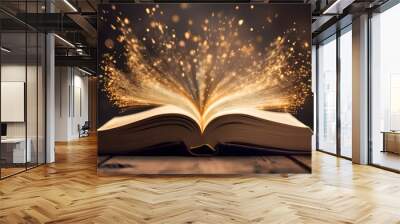 Open book glowing with magic light and sparkles Wall mural