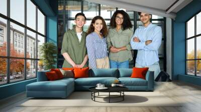 Diverse multiracial happy smiling colleagues international business startup creative team students standing looking at camera in modern office. Ethnicity, diversity, cooperation concept. Portrait Wall mural