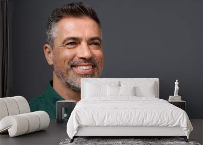 Happy middle aged business man entrepreneur, smiling mature professional confident businessman leader investor wearing green shirt looking aside isolated on gray, headshot close up portrait. Wall mural