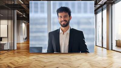 Happy professional young latin business man company employee, male corporate manager, businessman office worker looking at camera holding digital tablet standing in office, vertical portrait. Wall mural