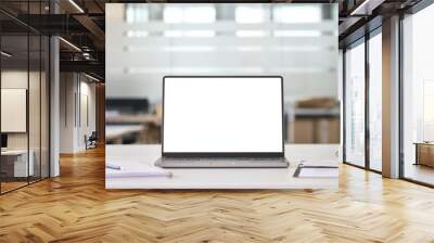 Laptop device mock up template design on office workplace desk, white mockup empty blank computer screen on office work table business web technology at modern workspace, closeup. Wall mural