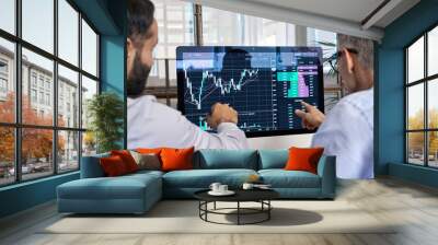 Two traders brokers stock exchange market investors discussing crypto trading charts growth using pc computer pointing at screen analyzing financial risks, investment profit forecast. Over shoulder Wall mural