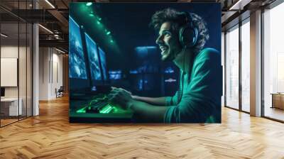 Happy professional male gamer playing video games on personal computer wearing gaming headset Wall mural