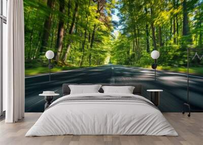 Motion blur of a straight asphalt road in the middle of the forest during the day Wall mural