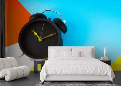 Clock on colorful background with selective focus and crop fragment. Copy space Wall mural