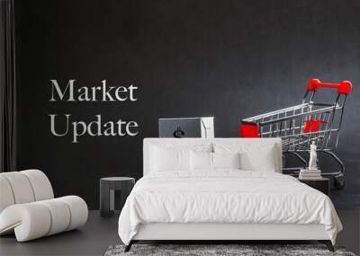 Shopping cart with words MARKET UPDATE on dark background. Business, Copy space and online shopping concept. Selective focus Wall mural