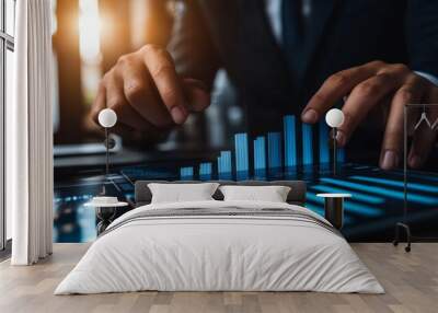 Hands of a businessman pointing at a column chart displaying yearly growth data, planning for long-term investments. Wall mural