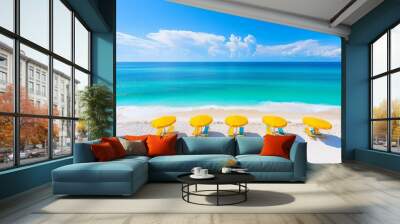 Rows of beach umbrellas on a sandy coastline, with the bright blue sky and turquoise waters creating a tranquil and inviting beachscape. Wall mural