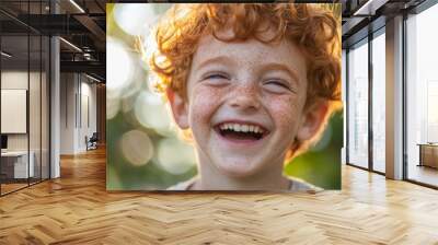 Portrait of a Freckled Boy with Red Hair Laughing Outdoors Wall mural