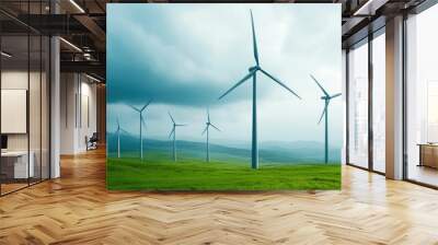 Spinning wind turbines standing tall in a dramatic stormy landscape symbolizing the balance between the pursuit of clean Wall mural