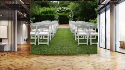 Stunning outdoor wedding ceremony taking place in a beautiful nature inspired garden setting with floral arch lush greenery and deep depth of field creating a romantic Wall mural