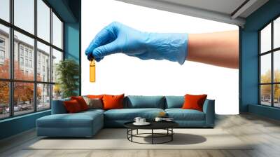 Close up of female doctor's hand in blue sterilized surgical glove holding transparent brown glass ampoule with a drug against white background Wall mural