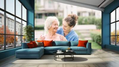 Caregiver with Asian elderly woman outdoor Wall mural