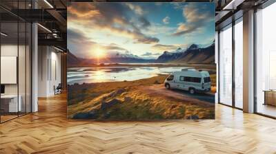 RV Motorhome camper van road trip. Tourists in rental car campervan by view of mountains in beautiful nature landscape on the road in Iceland at sunset. People on travel vacation adventure. Wall mural