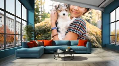 Portrait of happy, smiling teen girl with puppy Wall mural