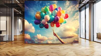 Colorful balloons floating against vibrant sky during sunset Wall mural