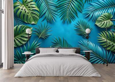 Tropical palm leaves on bright blue background Wall mural