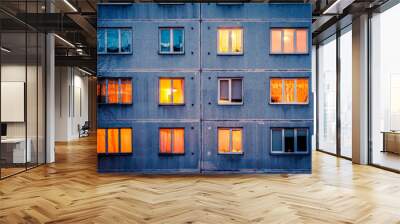 Wall with Iluminated windows. Detail of soviet era block apartment building Wall mural