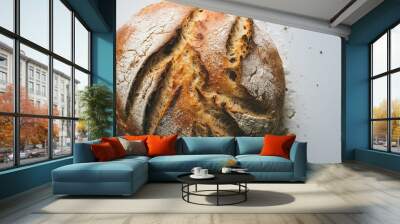 Homemade whole round bread sprinkled with flour closeup on white background Wall mural