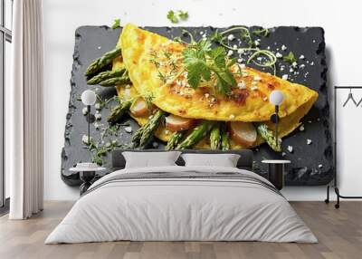 Omelete with vegetables and micro greens on a black stone tray isolated on a white background Wall mural