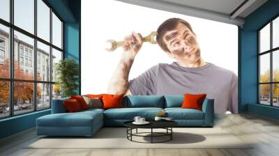 dirty and funny mechanic with wrench thinking isolated on white Wall mural