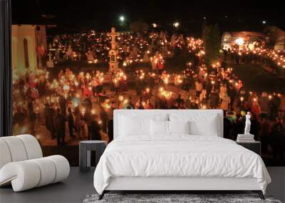 people with light and candles in the night. Orthodox church scene, Romania Wall mural