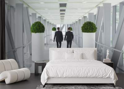 two business men people walking in modern building, vision or success concept Wall mural