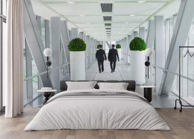 two business men people walking in modern building, vision or success concept Wall mural